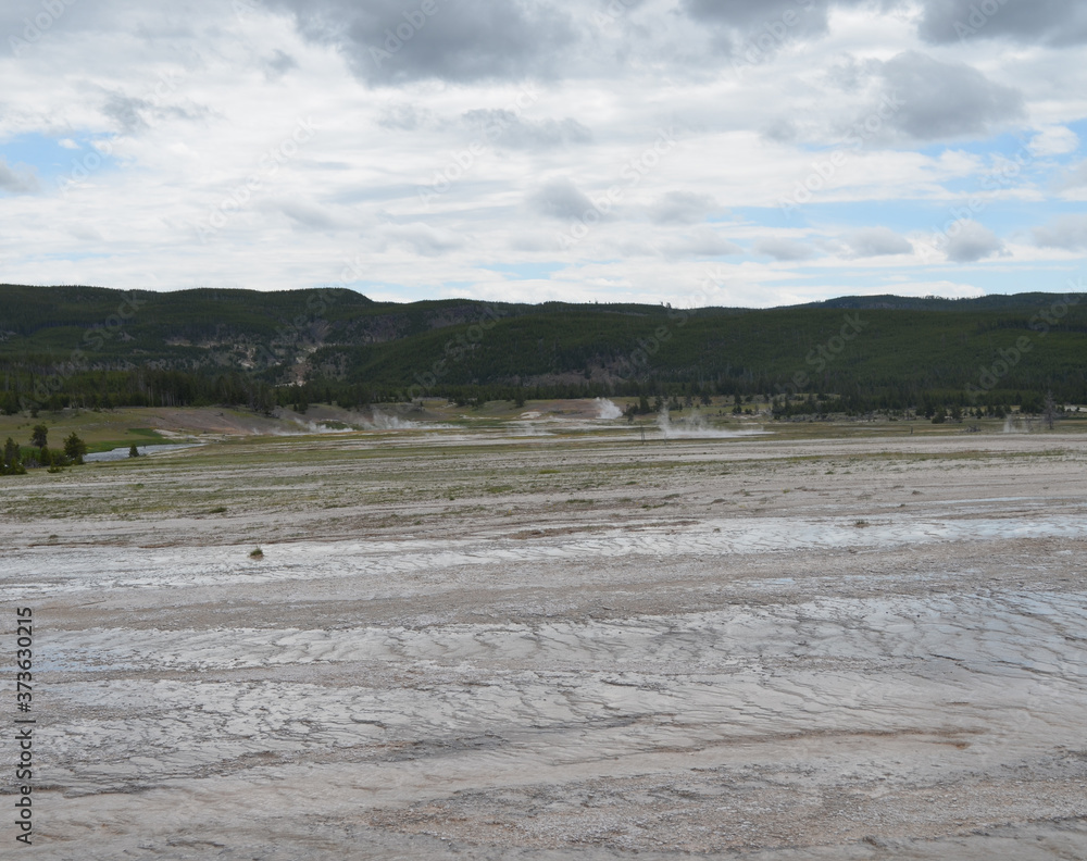Late Spring in Yellowstone National Park: Tromp Spring and Firehole River Along with Flood, West Flood & Catfish Geysers of the Flood Group in Midway Geyser Basin Late Spring in Yellowstone National Park: Tromp Spring and Firehole River Along with Flood, West Flood & Catfish Geysers of the Flood Group in Midway Geyser Basin