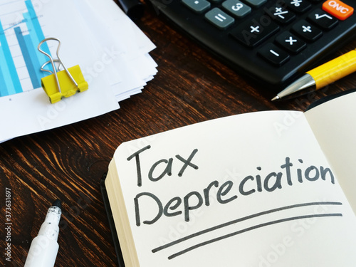 Tax depreciation phrase on the notepad page. photo