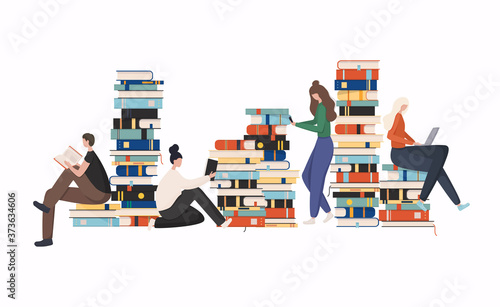 Young stylish people readers sitting on stack of giant books or beside it and reading.