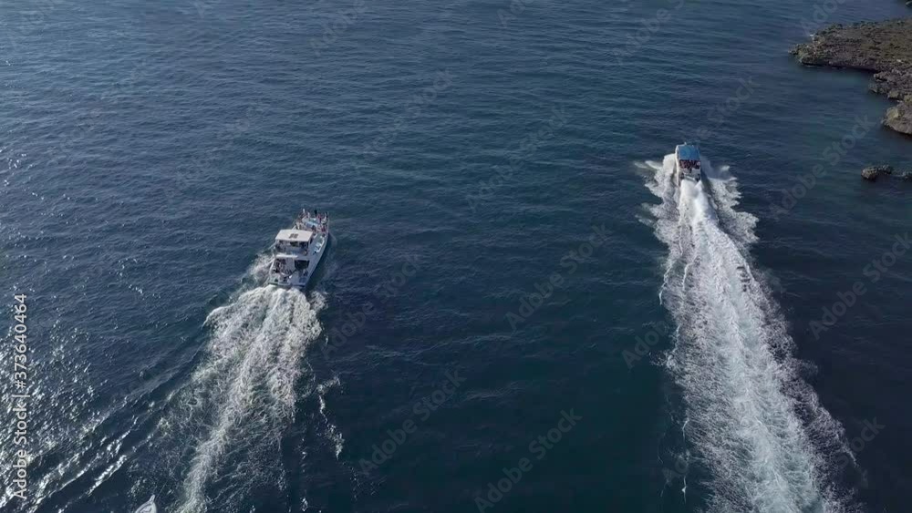 Flying over speedboats moving fast in Caribbean sea Flying over speedboats moving fast in Caribbean sea