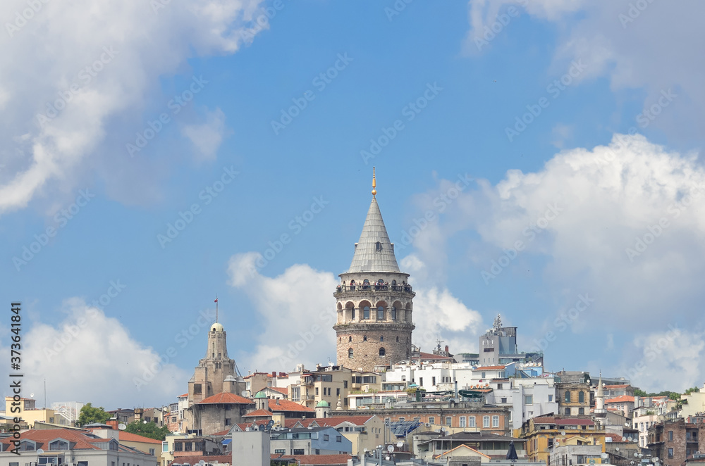 Istanbul cityscape including historical Galata Tower in a cloudy day
