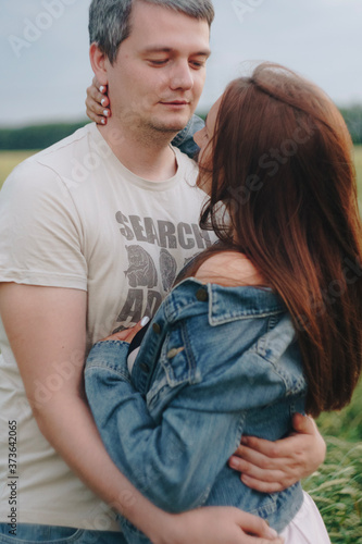 A girl and a man in love in a field of rye