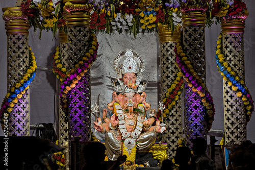 Closeup,landscape view of decorated & garlanded Isolated idol Panchmukhi Ganesha photo