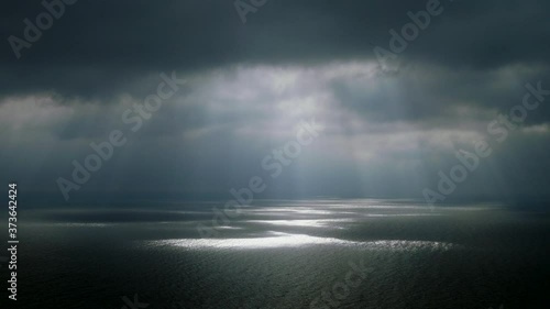 Scenic seascape. Beautiful rays of sun breaking through the clouds over The Black sea. 4K