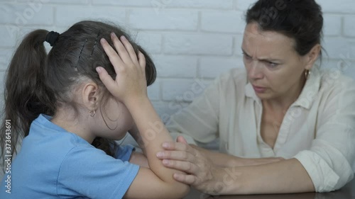 Mother calm the child. The mother pity the grieved little daughter.