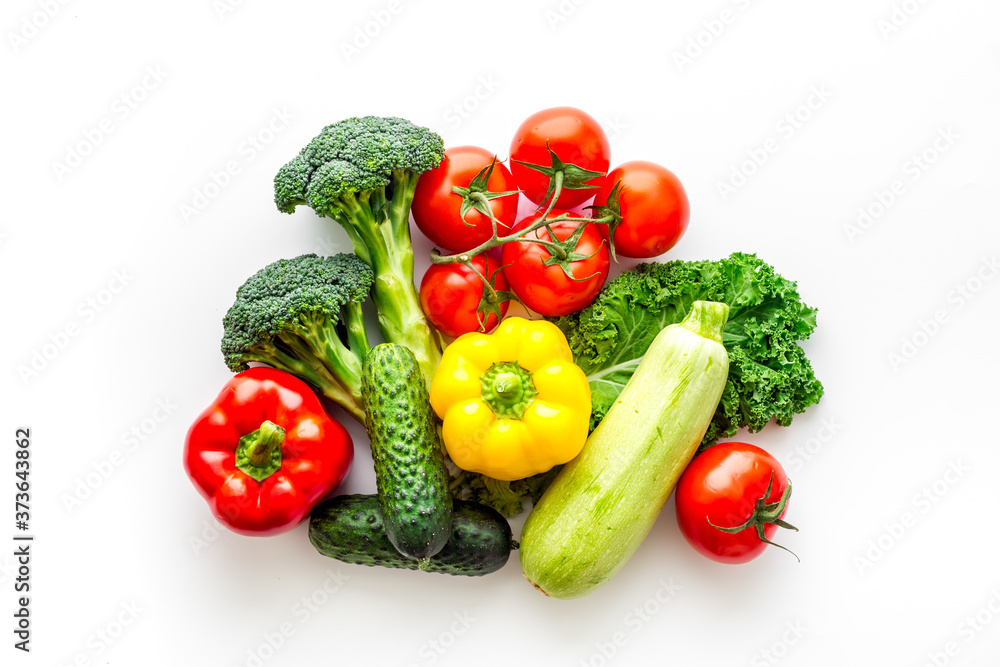 A tabletop arrangement of fresh vegetables multicolored, top view