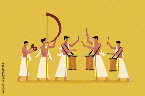 People wearing Kerala style traditional dress playing percussion instruments