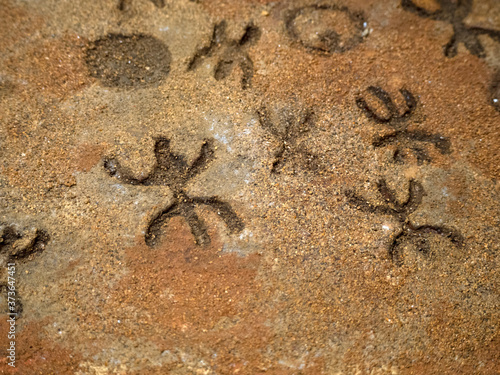 Принти на полотні nuragic stone age old petroglyphs runic writings inside Sea Oxen Grottoes Sardin