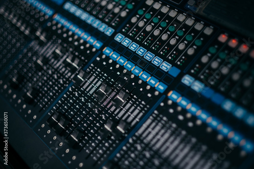 audio sound mixer controller at studio in dark background