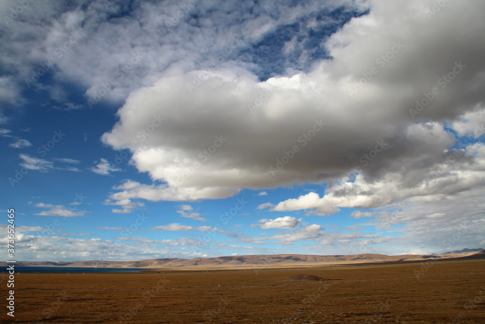 View of mountains with the dramatic sky near Namtso in Tibet, China