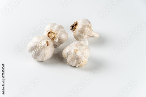 Heads and cloves of garlic isolated on white background