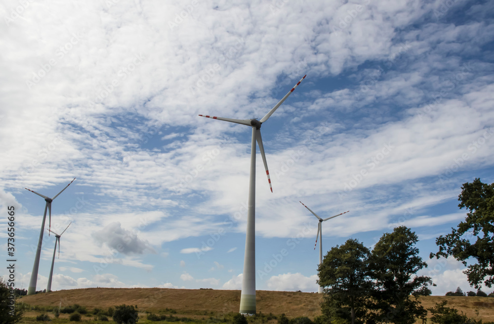 Wind turbine on the background of the sky. Who stand in the field.
Wind turbine on the background of the sky. Who stand in the field.