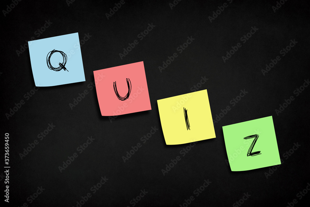 Note papers with quiz time concept design on chalkboard Note papers with quiz time concept design on chalkboard