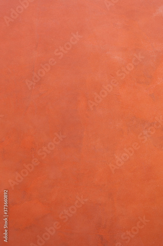 Terracotta microcement texture background © LALSSTOCK
