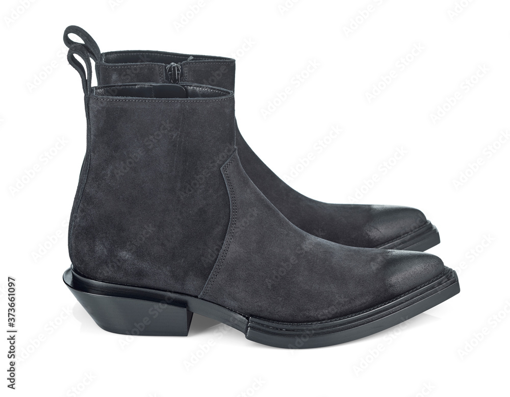 Black suede half-boots with a narrow toe and a slanted heel. Cowboy boots. Side view. Black suede half-boots with a narrow toe and a slanted heel. Cowboy boots. Side view.