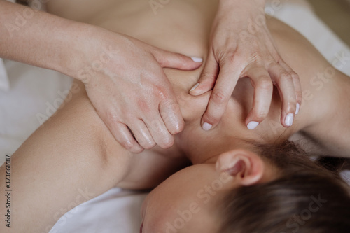 Masseur Hands Make Neck Massage Closeup Photo