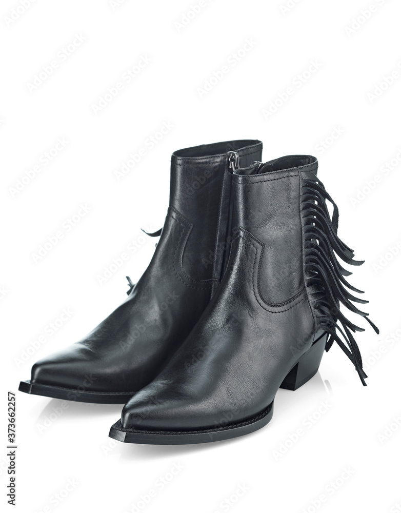 Black leather half-boots with a leather fringe on the top, a narrow toe and a sloping heel. Cowboy boots. Top view at an angle.