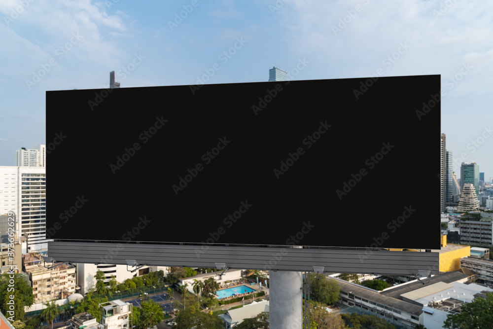Blank black road billboard with Bangkok cityscape background at day time. Street advertising poster, mock up, 3D rendering. Front view. The concept of marketing communication to promote or sell idea. Blank black road billboard with Bangkok cityscape background at day time. Street advertising poster, mock up, 3D rendering. Front view. The concept of marketing communication to promote or sell idea.