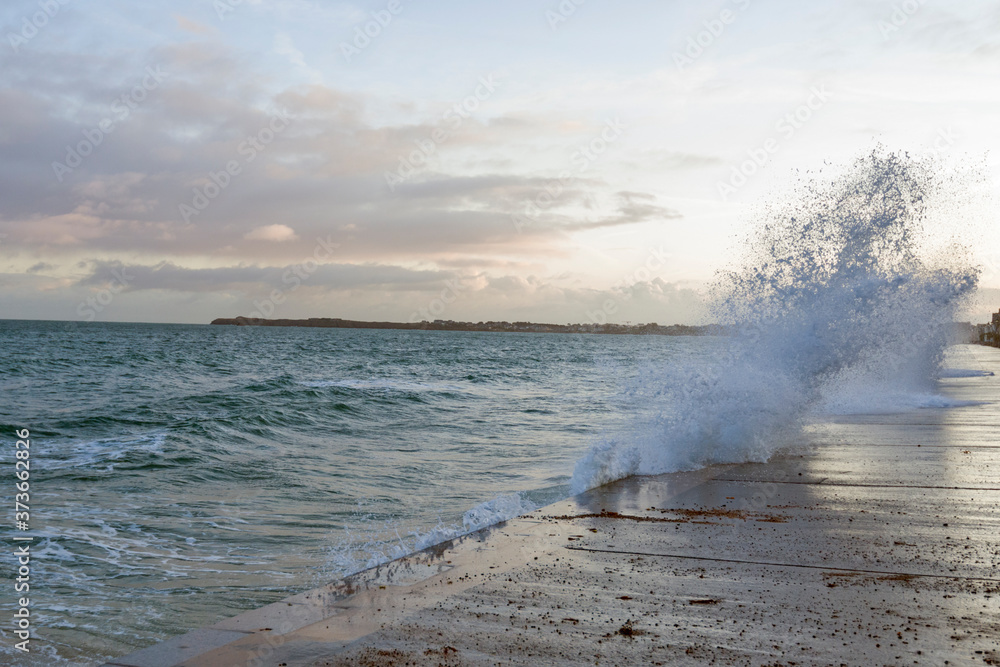 Big high tide and big waves on the Chaussée du Sillon in Saint Malo, Brittany, France