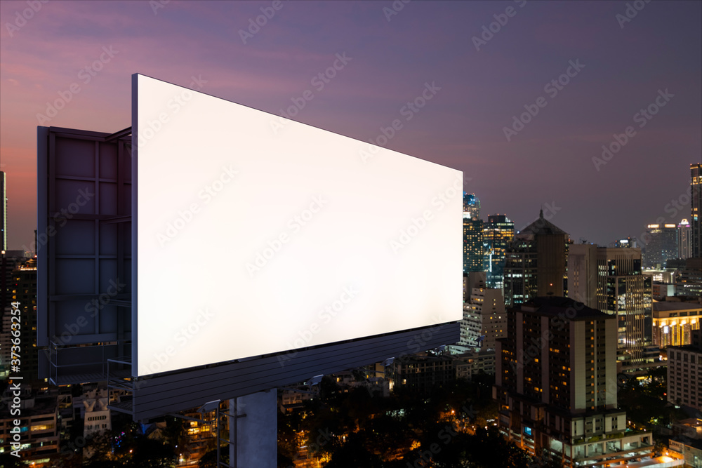Blank white road billboard with Bangkok cityscape background at night time. Street advertising poster, mock up, 3D rendering. Side view. The concept of marketing communication to sell idea. Blank white road billboard with Bangkok cityscape background at night time. Street advertising poster, mock up, 3D rendering. Side view. The concept of marketing communication to sell idea.