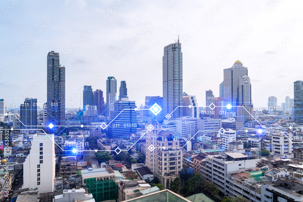 Obraz premium Technology hologram over panorama city view of Bangkok. The largest tech hub in Asia. The concept of developing coding and high-tech science. Double exposure.
