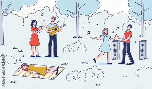 People enjoy music outdoors: street musician singing and playing guitar and couple dancing in park