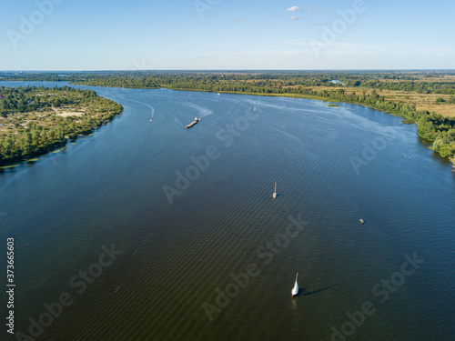 Boats and yachts on the Dnieper river. Aerial drone view, sunny summer day.