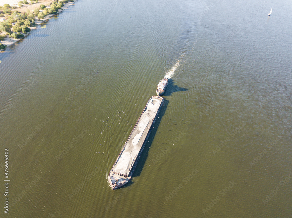 Fototapeta premium Aerial drone view. The barge sails along the Dnieper River.
