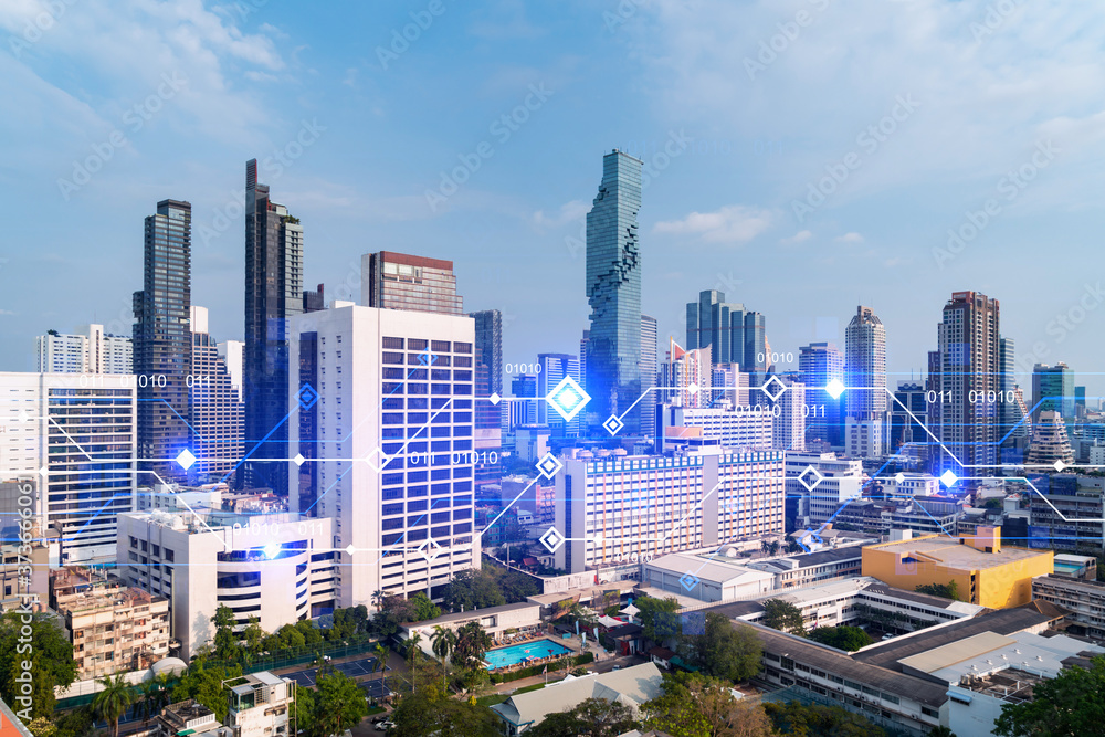 Technology hologram over panorama city view of Bangkok. The largest tech hub in Asia. The concept of developing coding and high-tech science. Double exposure.