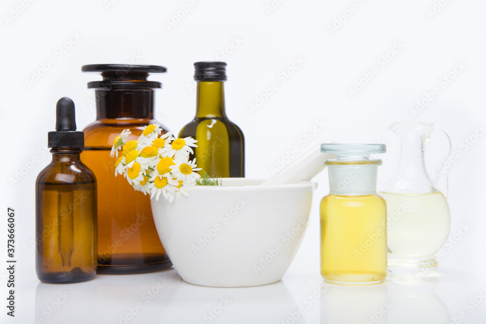 Herbal medicine products and medicine grinder on white background Herbal medicine products and medicine grinder on white background