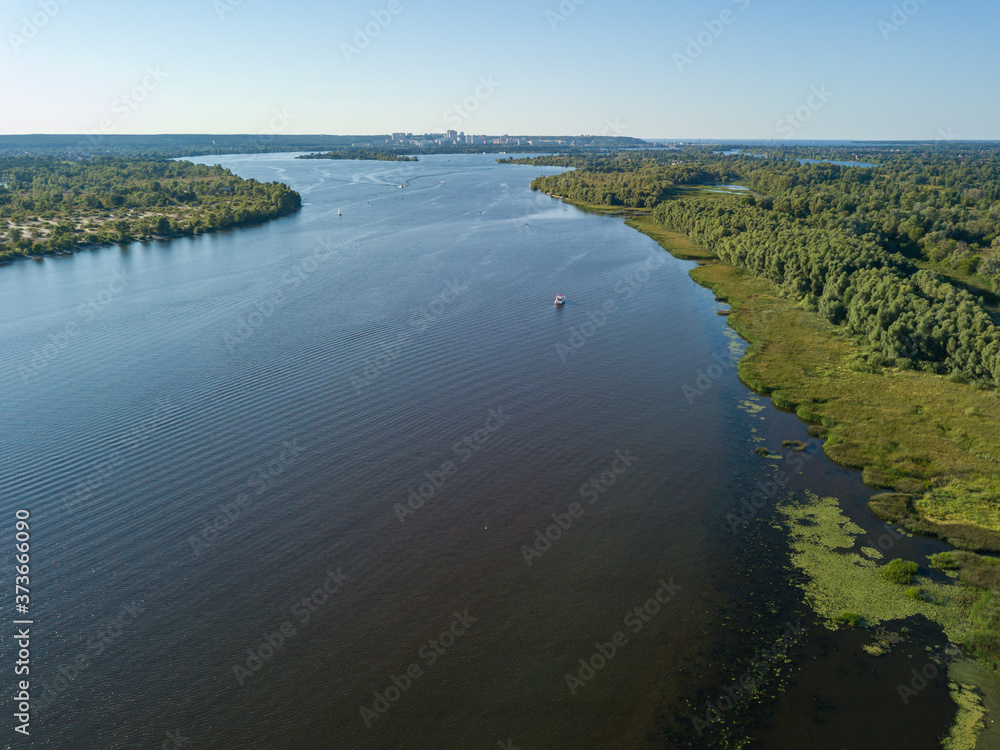 Aerial drone view of green water in the Dnieper river in Kiev.