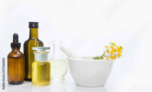 Herbal medicine products and medicine grinder isolated on white background