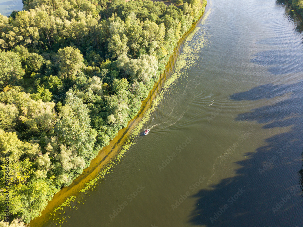 Aerial drone view. Motor boat on the Dnieper river in Kiev.