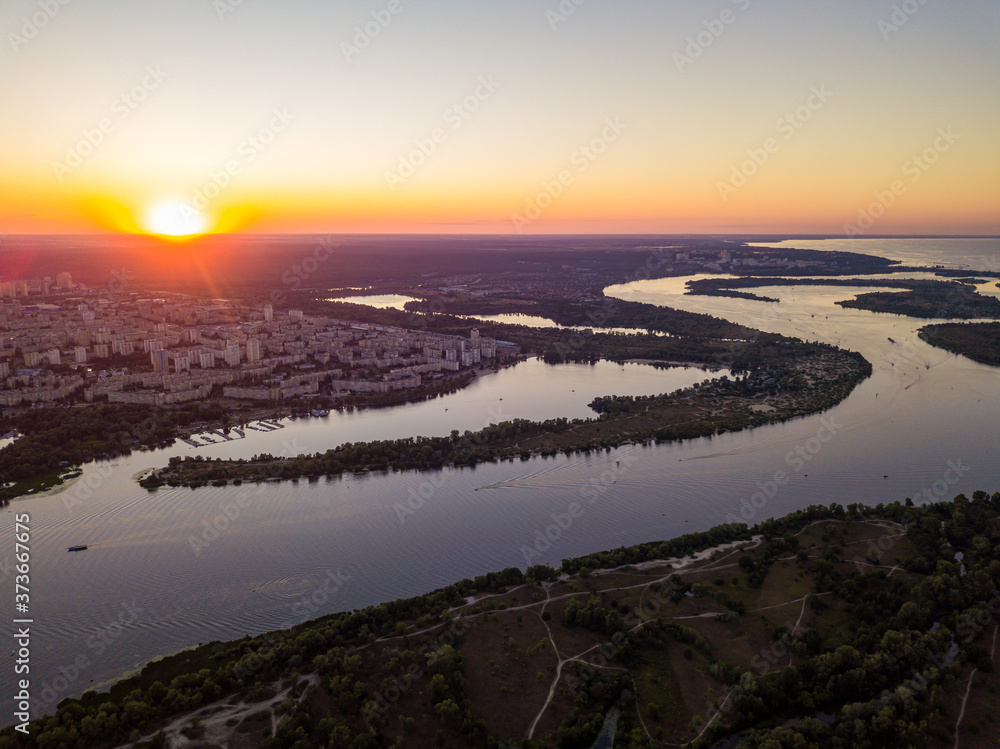 Aerial drone view. Sunset over the Dnieper River and the city of Kiev.