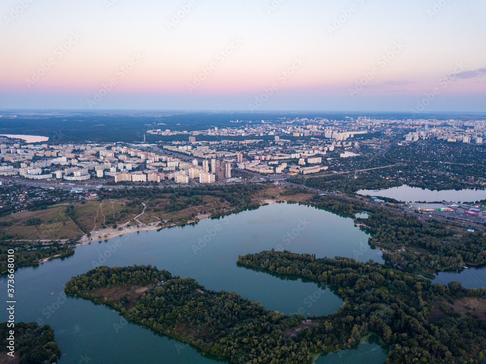 Aerial view. Dnieper river and Kiev city at dusk.