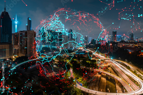 Hologram of Earth planet map on night panoramic cityscape of Kuala Lumpur  Malaysia  Asia. The concept of international companies in KL. Multi Exposure.