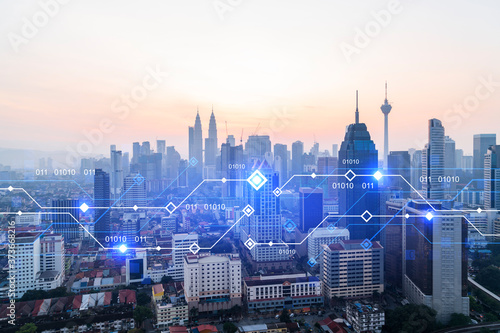 Photography Glowing hologram of technological process, aerial panoramic cityscape of Kuala Lumpur at sunset