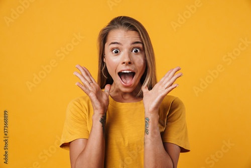 Image of blonde excited woman expressing surprise on camera photo