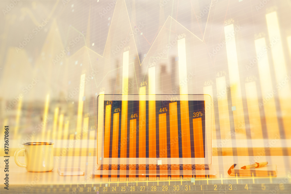 Forex Chart hologram on table with computer background. Double exposure. Concept of financial markets. Forex Chart hologram on table with computer background. Double exposure. Concept of financial markets.
