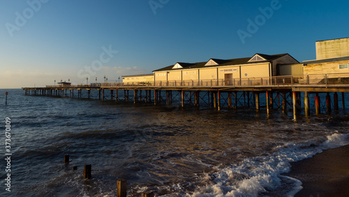 Grand Pier illuminated by the summer sunrise © Robyn of Exeter