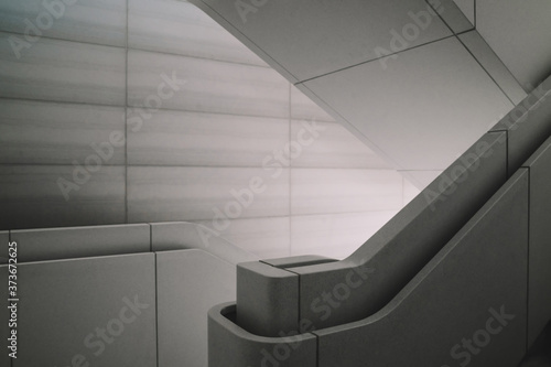 Modern interior design of concrete staircase with beautiful interior light. Contemporary architecture construction with clear space design