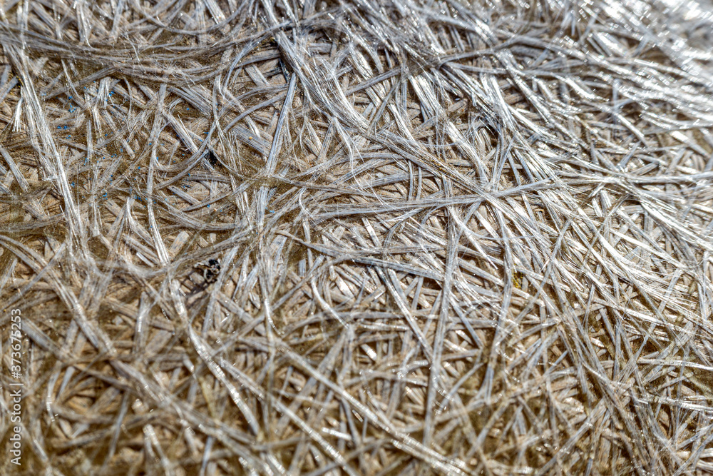 Fiberglass macro glued together to make a durable and strong material. Fiberglass macro glued together to make a durable and strong material.