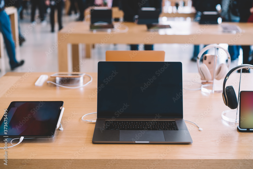 Cupertino , California / USA - November 17, 2018, Apple Park Visitor Center. Laptop Product, Mac Book Pro Computer with Ipad tablet and Iphone near Cupertino , California / USA - November 17, 2018, Apple Park Visitor Center. Laptop Product, Mac Book Pro Computer with Ipad tablet and Iphone near