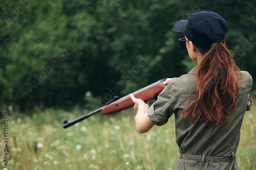Woman on outdoor Holding a weapon is a hunting lifestyle black cap 