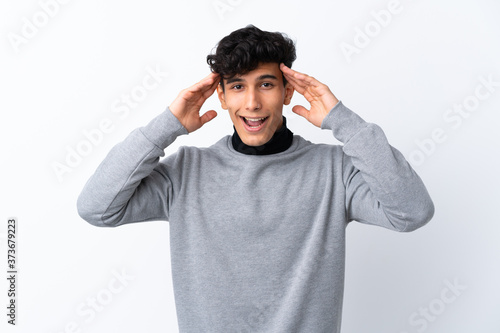 Young Argentinian man over isolated white background with surprise expression