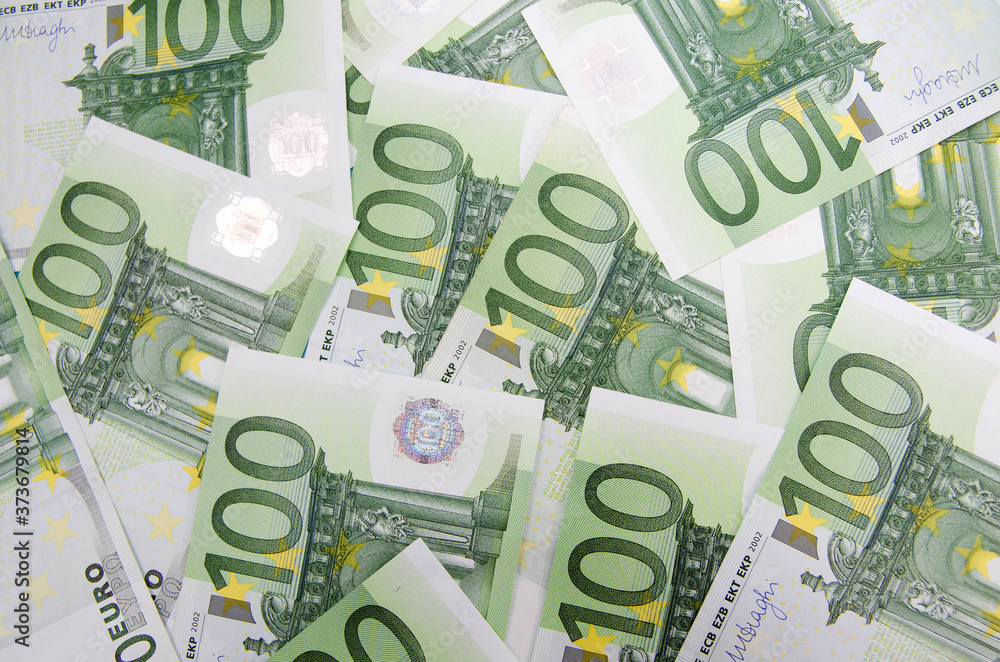 many banknotes of 100 Euro, the European currency, the concept of income and inflation many banknotes of 100 Euro, the European currency, the concept of income and inflation