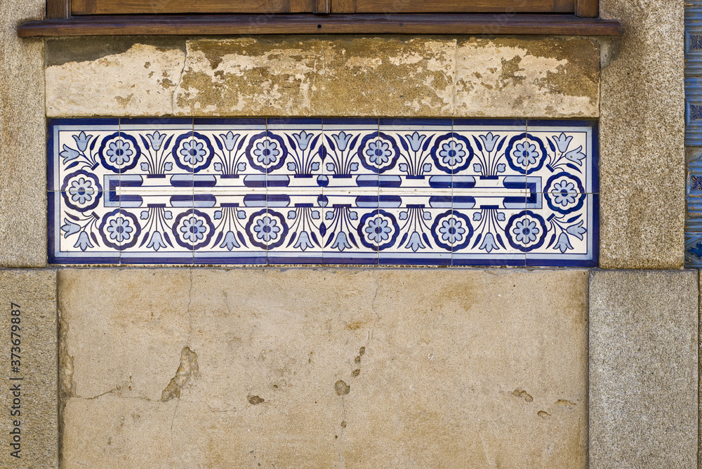 old Portuguese traditional ceramic tiles Azulejos on a wall in Aveiro, Portugal.