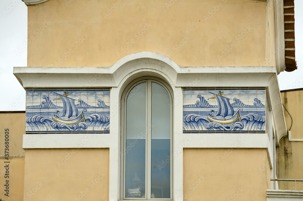 Fototapeta premium old Portuguese traditional ceramic tiles Azulejos on a tower in Aveiro, Portugal.