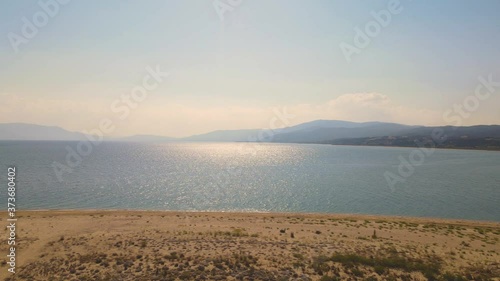 4K aerial drone clip rotating over the peninsula  over the beach near Strymonas river in Macedonia, Greece