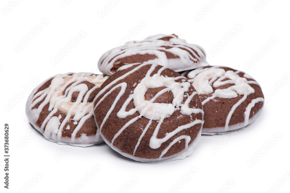 Fototapeta premium Group of round chocolate cookies drizzled with white icing